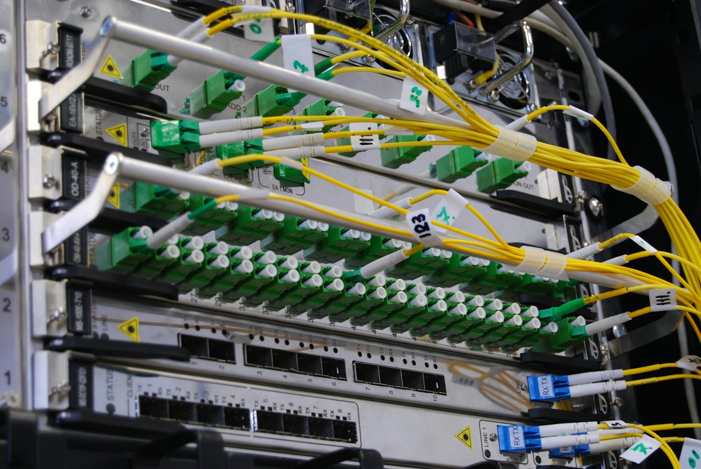 Labeled fiber and copper patching in a network rack