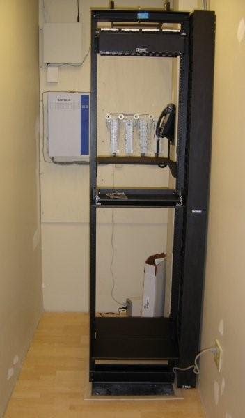 Office telecom closet: Floor rack, voice blocks and pathways ready for the network gear.